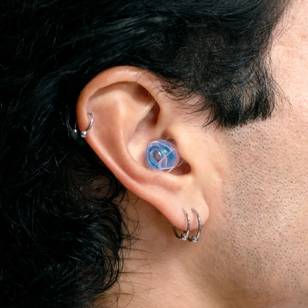 Eargasm High Fidelity earplug worn in a person's ear